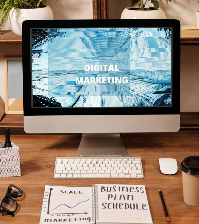 Contemporary office setup featuring digital marketing strategy on a computer screen, ideal for business technology themes.